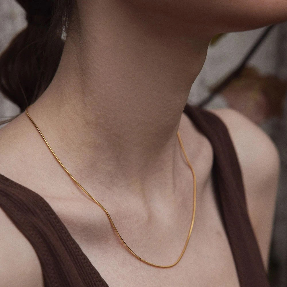 Dainty Snake Chain Necklace crafted from high-quality 925 sterling silver. Classic and versatile design. Adjustable length, available in 18K gold, rose gold or sterling silver